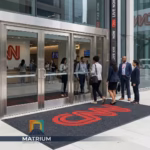 Custom CNN logo entrance mat for corporate headquarters by Matrium Entrance Branding Systems.